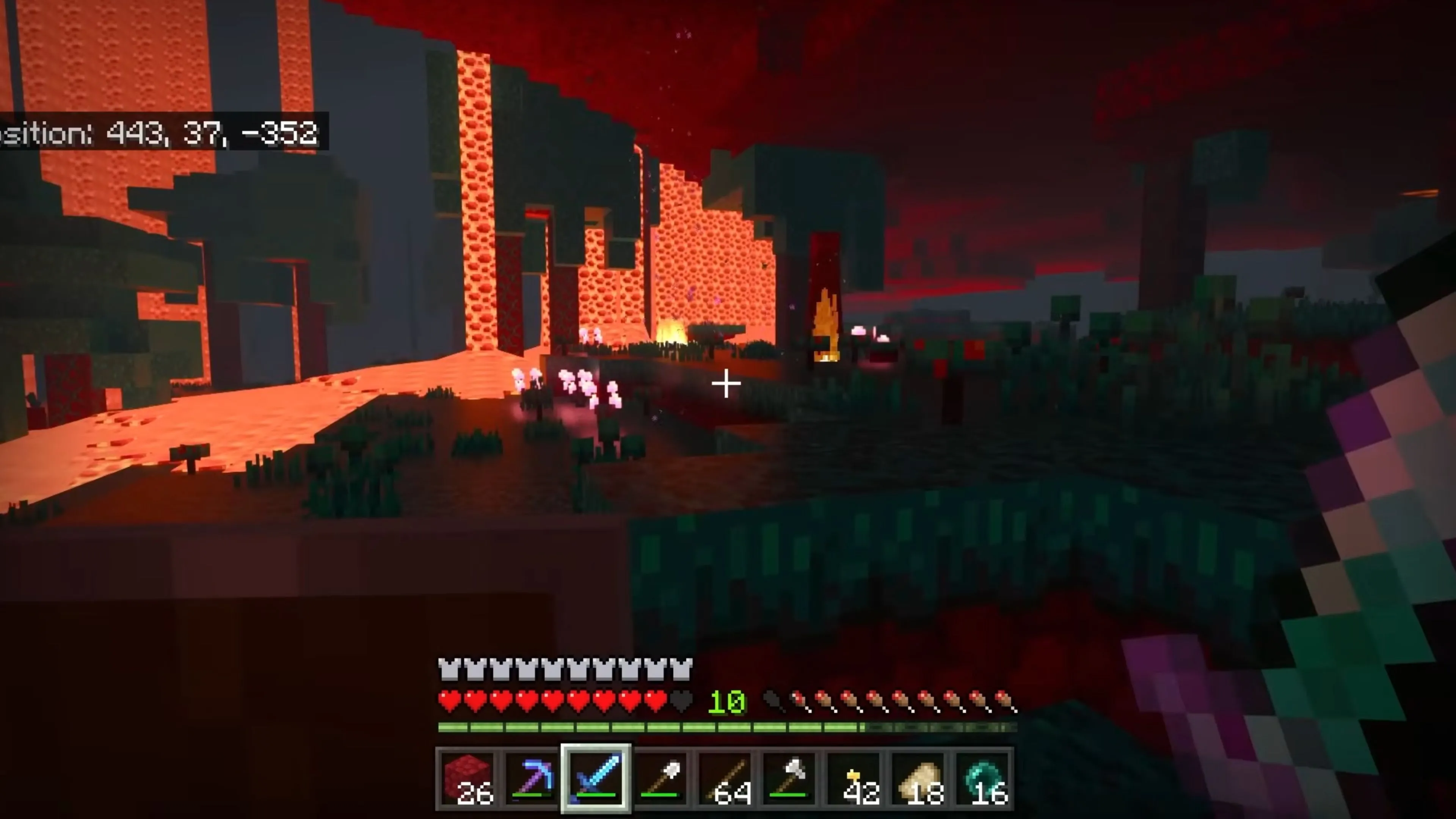 Cảnh quan tươi đẹp trong Minecraft với những ngọn đồi xanh mướt, sông hồ và một vài cây lớn, gợi cảm giác về thế giới mở.