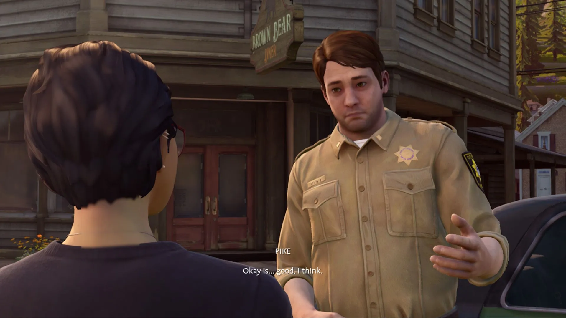 Giao diện hội thoại giữa cảnh sát ảo và công dân trong Life Is Strange: True Colors, thể hiện yếu tố tương tác cốt truyện.