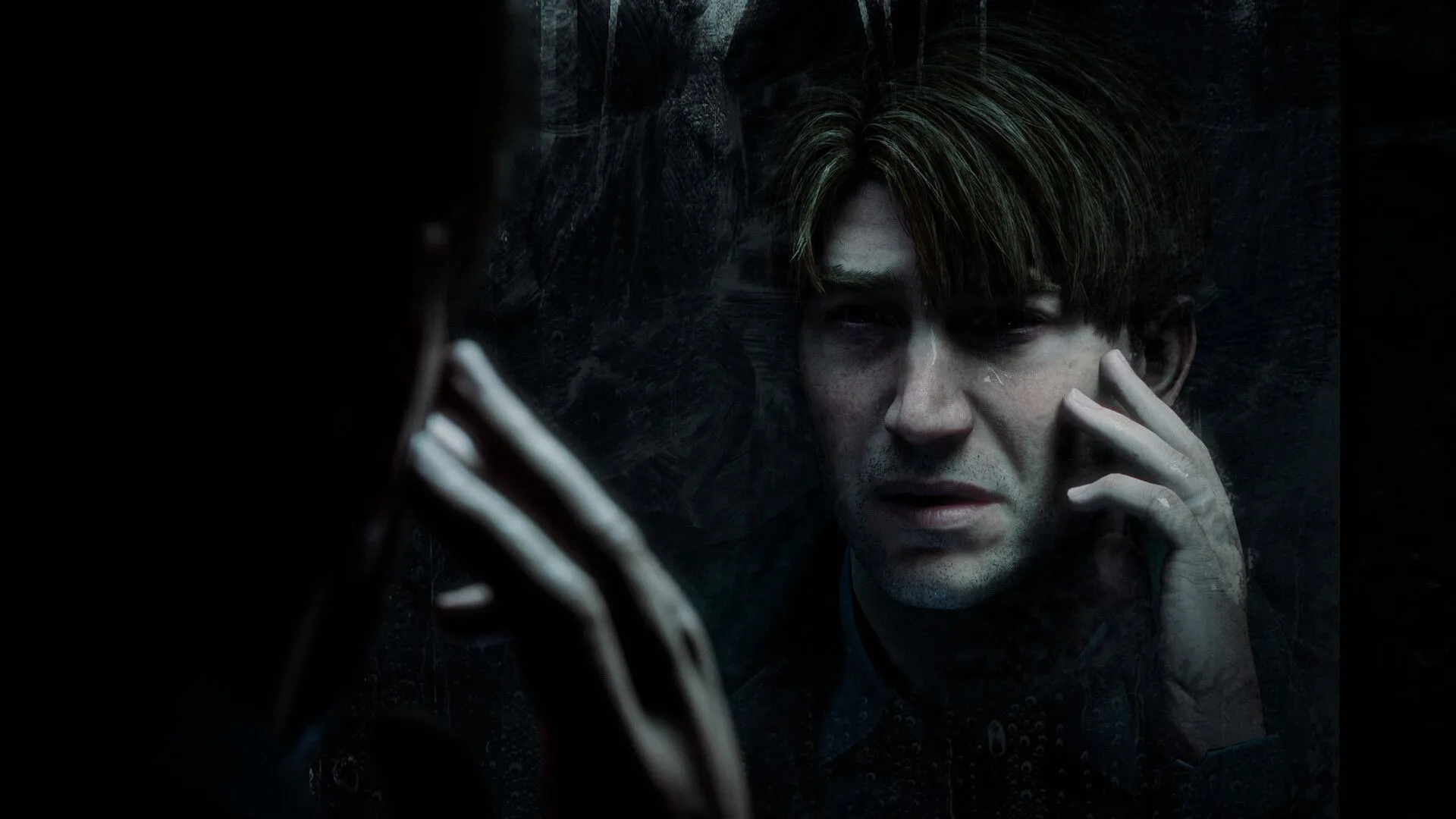James Sunderland nhìn vào gương trong Silent Hill 2 (2024), bản remake của trò chơi kinh dị cổ điển.