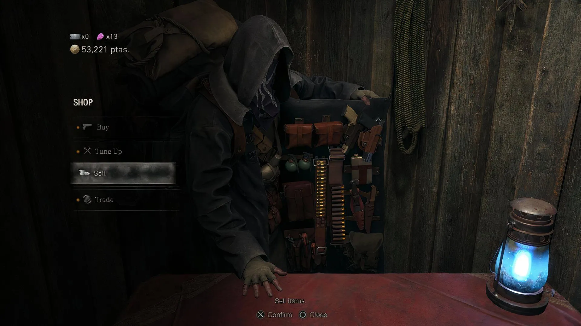 Leon S. Kennedy và thương nhân trong Resident Evil 4 Remake trên PlayStation 5.