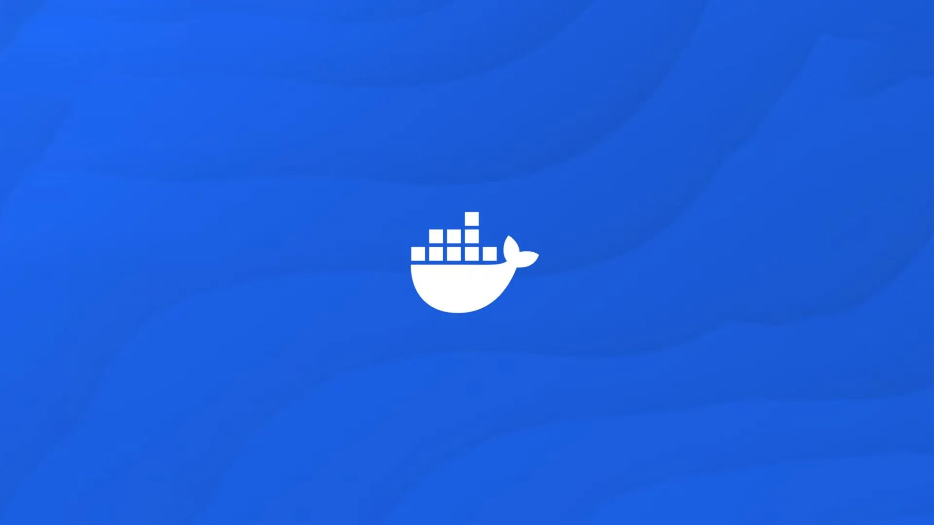 Logo Docker màu trắng trên nền xanh dương, biểu tượng của công nghệ container hóa.