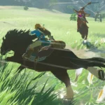 Màn hình trò chơi The Legend of Zelda: Breath of the Wild với khung cảnh đồng cỏ xanh mướt và Link đang nhìn về phía ngọn núi lửa Death Mountain.