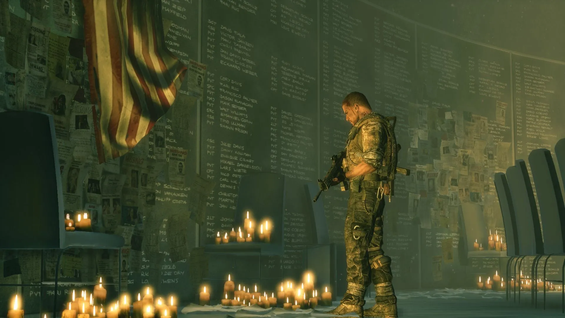 Martin Walker, nhân vật chính của Spec Ops: The Line, đang nhìn vào một bức tường tưởng niệm trong bối cảnh Dubai bị bão cát tàn phá.