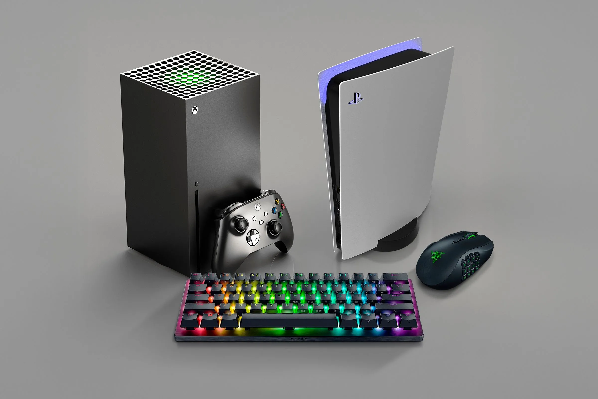Máy chơi game Xbox và PlayStation cùng bàn phím chuột, minh họa khả năng kết nối ngoại vi