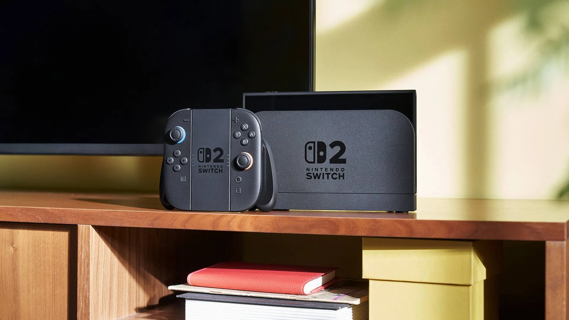 Máy Nintendo Switch 2 cùng Joy-Cons đang được kết nối với TV ở chế độ dock.