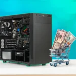 Một vỏ case máy tính và một xe đẩy hàng thu nhỏ với một vài tờ đô la, biểu trưng cho chi phí lắp đặt PC.
