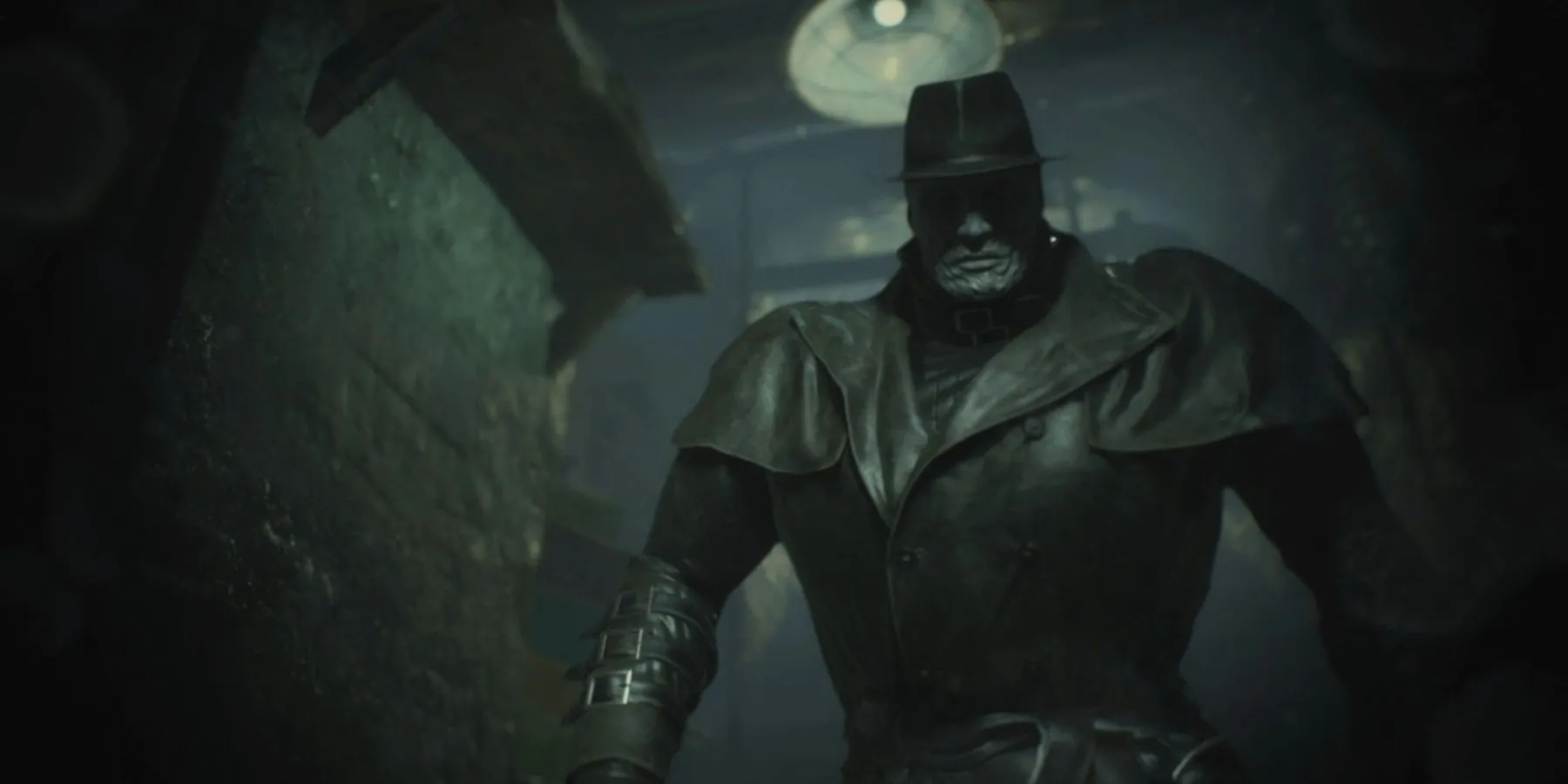 Mr. X đứng đe dọa trong bóng tối của game Resident Evil 2 Remake, biểu tượng của sự truy đuổi và áp lực.