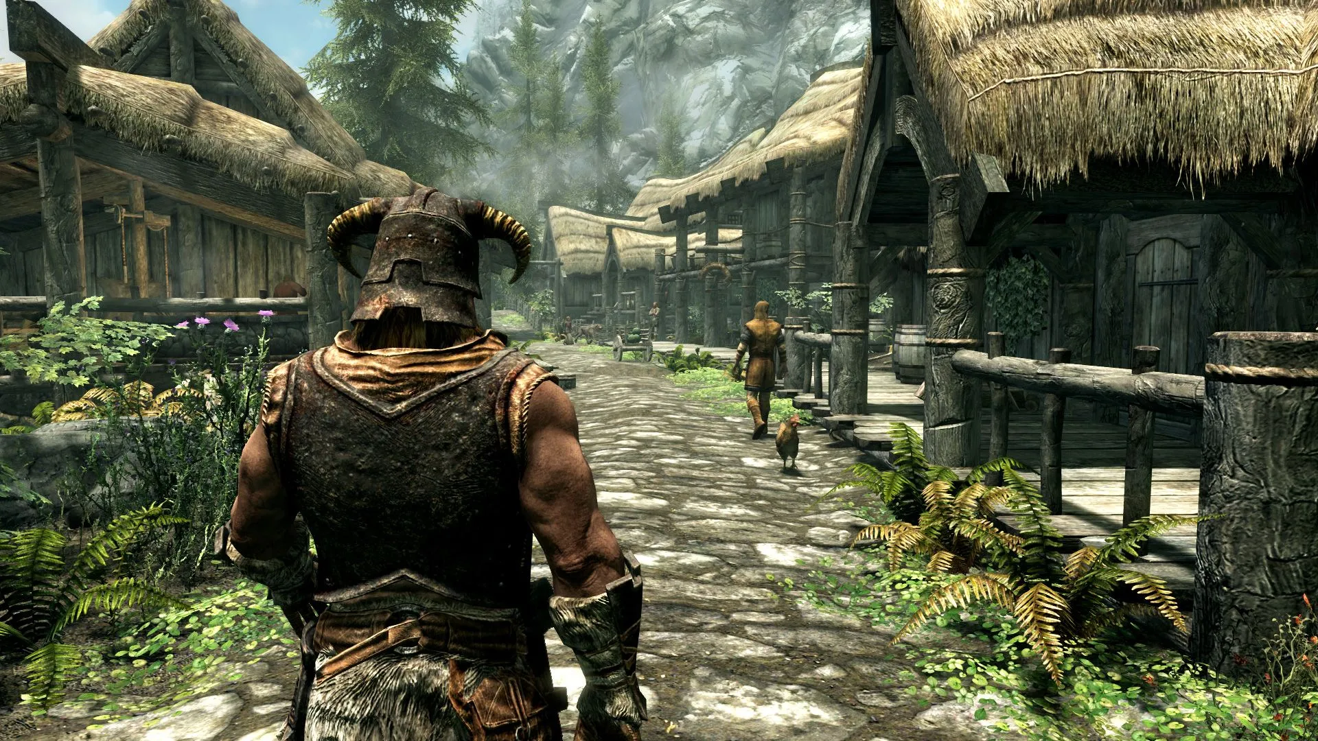 Nhân vật chính đi bộ trên con đường ở Riverrun trong The Elder Scrolls V: Skyrim, với một cây cầu đá ở phía xa.