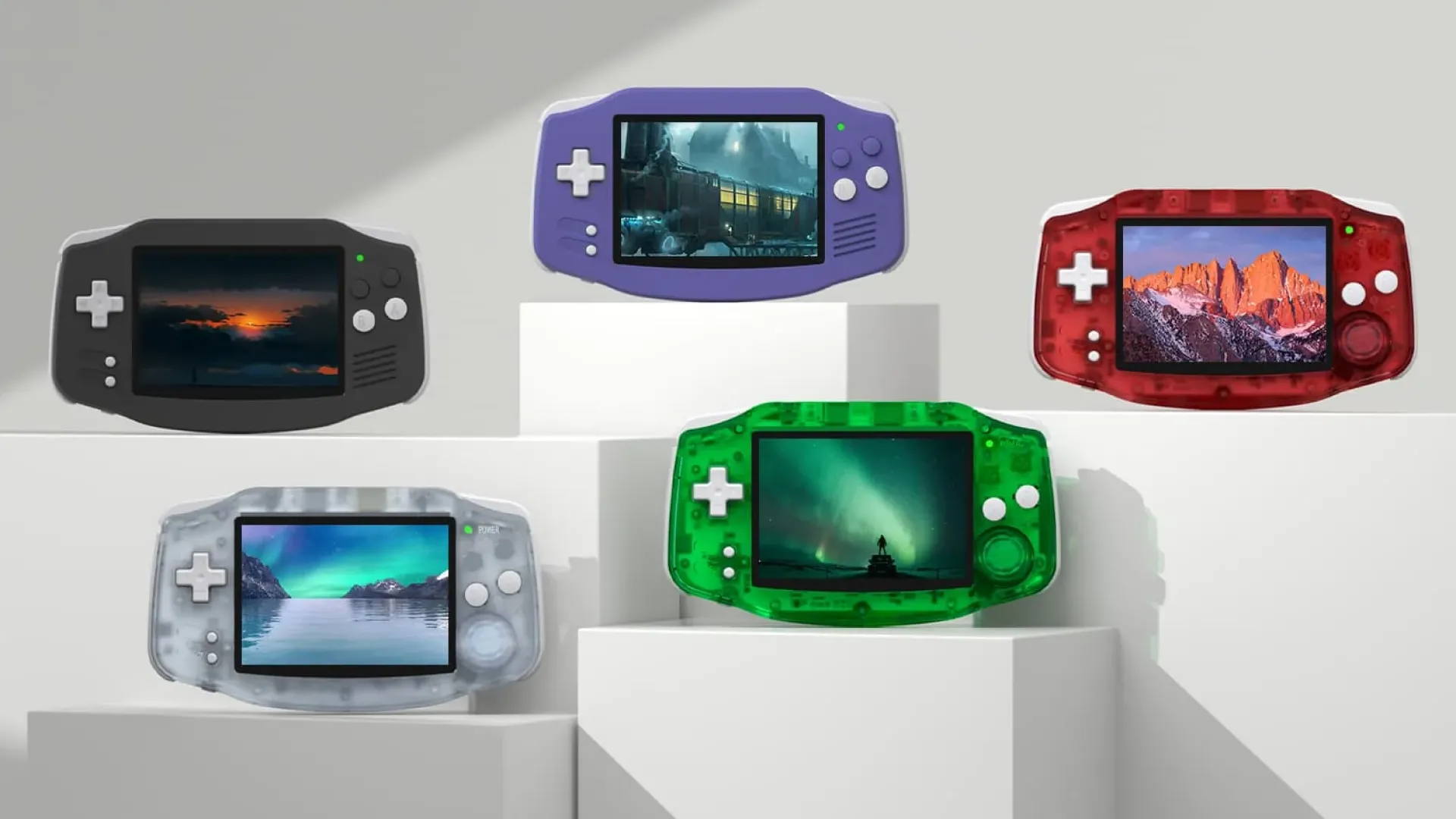 Nhiều máy chơi game cầm tay Anbernic RG-34XX với các màu sắc khác nhau xếp hàng, phù hợp giả lập GBA