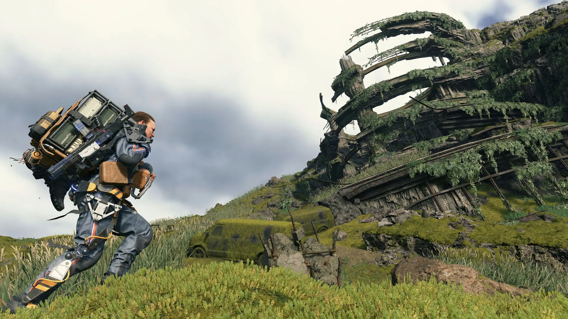 Sam Porter Bridges đang vận chuyển gói hàng trong Death Stranding, tượng trưng cho lối chơi cốt lõi gây chia rẽ của tựa game này.