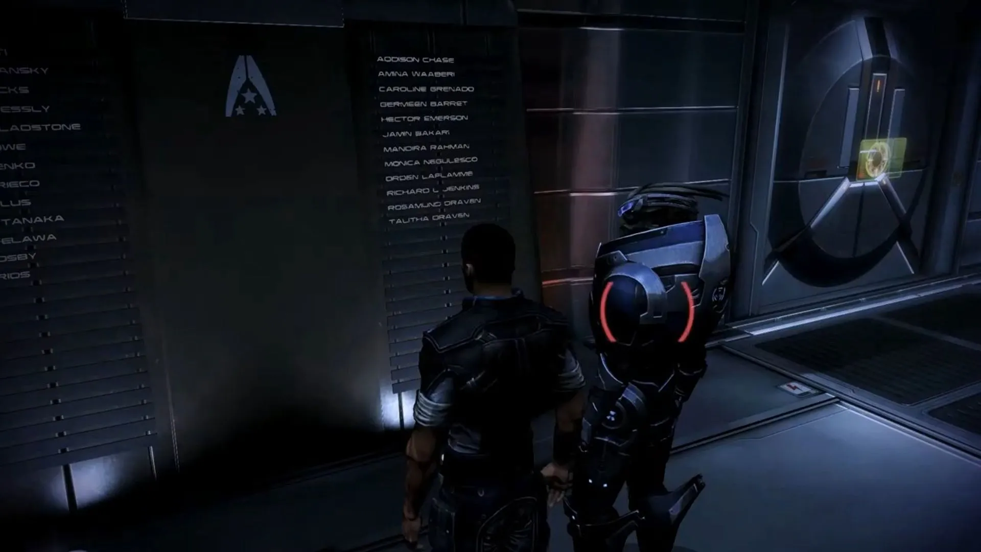 Shepard và Garrus tại bức tường tưởng niệm trong Mass Effect 3, đại diện cho những lựa chọn và hậu quả trong hành trình chơi game.