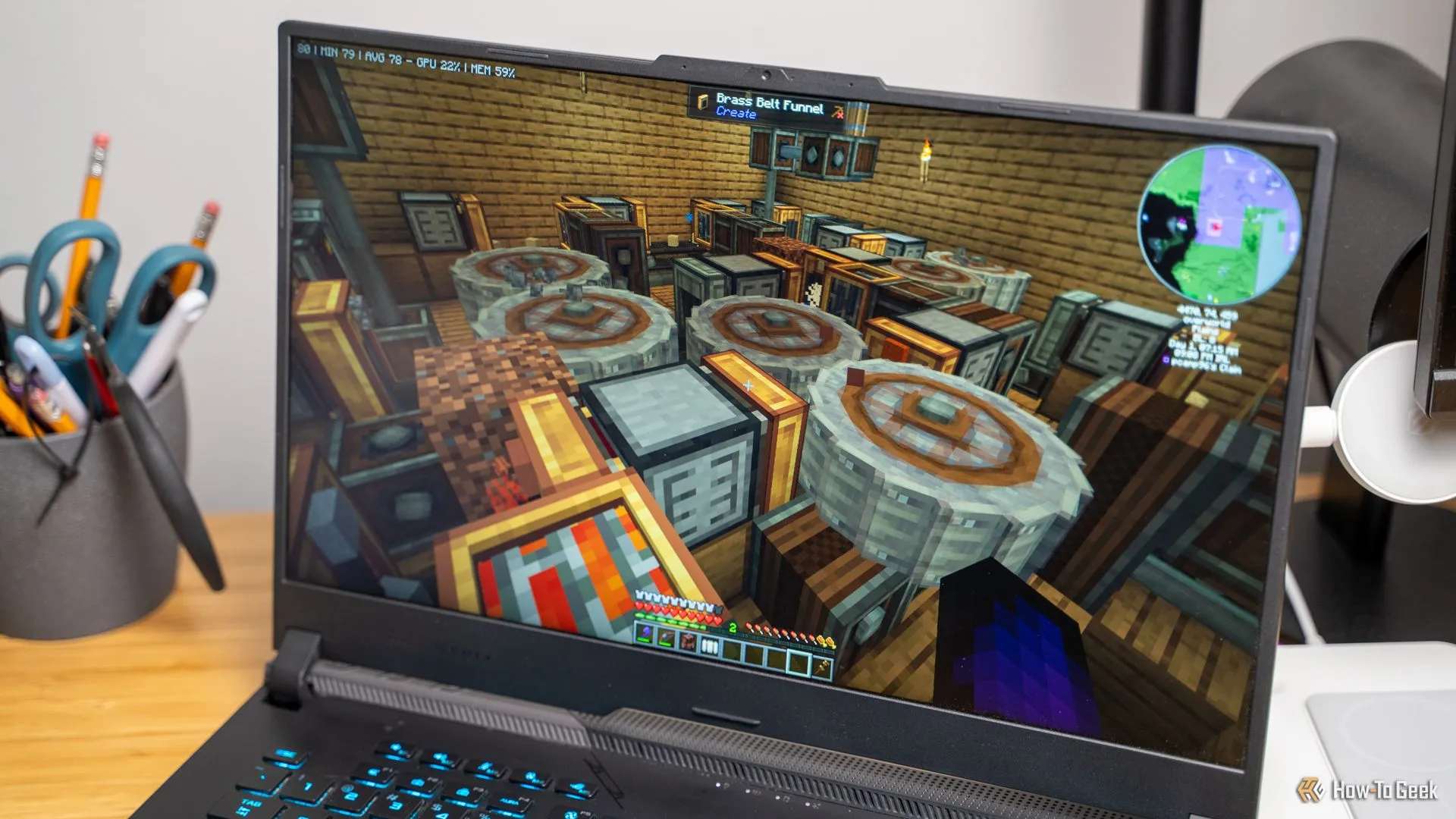 Trang trại sắt được xây dựng bằng mod Create trong Minecraft, đang chạy trên máy tính xách tay, thể hiện gameplay với mod.